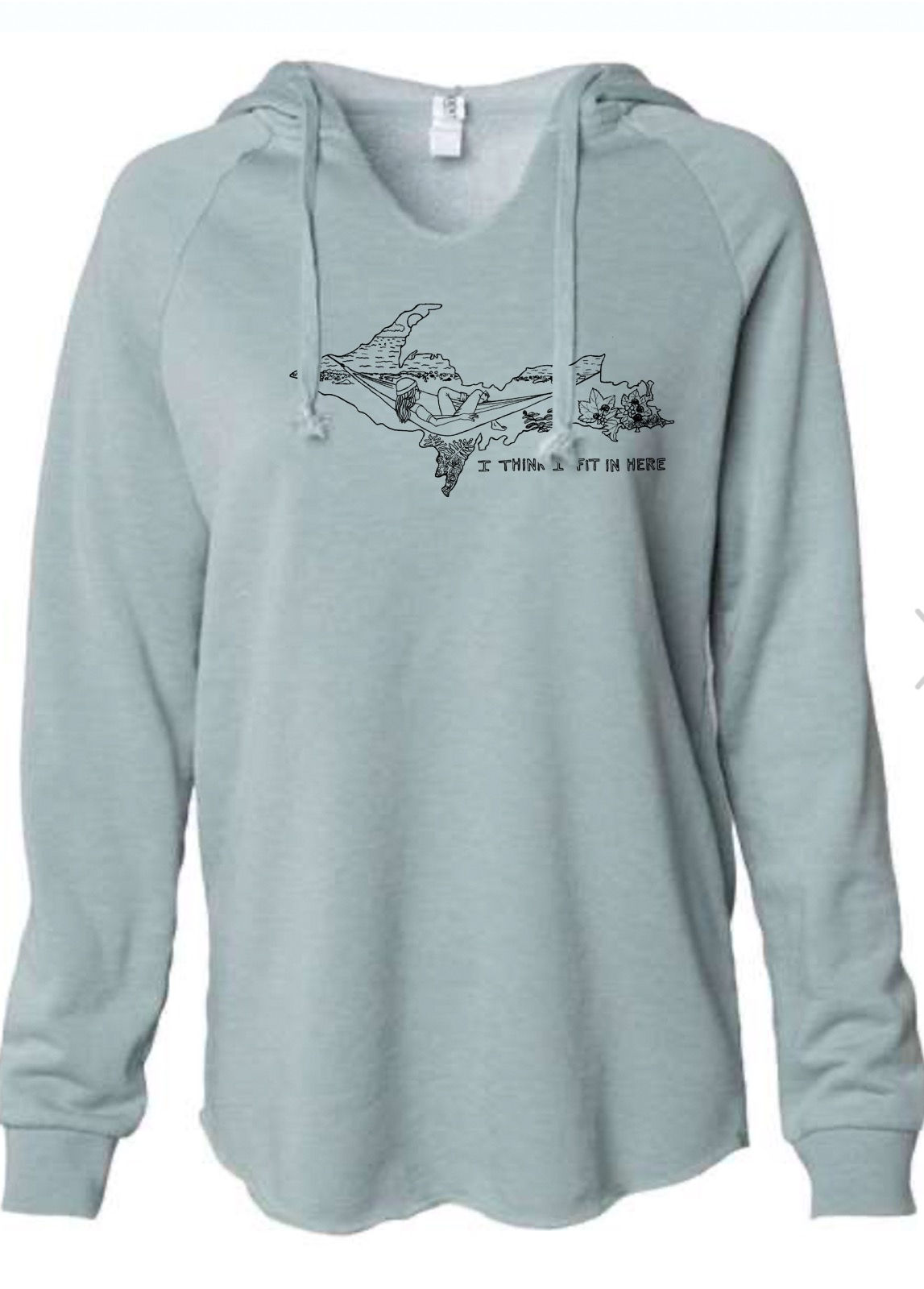 Pretty woman walking and wearing a mother superior u.p. shirt by Lake Superior on a sunny day in marquette mi