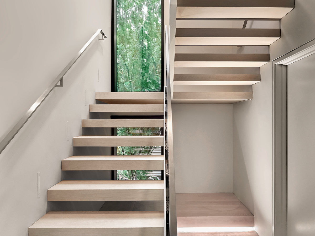 Switchback staircase with view outside.