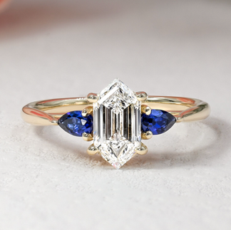 trapezoidal diamond and sapphire yellow gold engagement ring