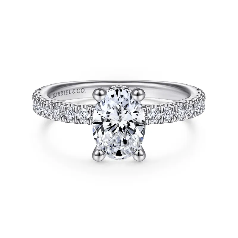 white gold oval diamond engagement ring with diamond shank