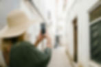 woman takes a tiktok in a town