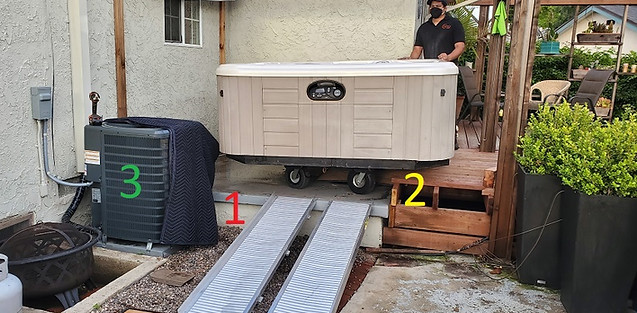 Luna's Spa Movers - Using a 6ft loading ramp to bring a hot tub down