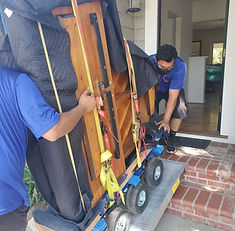 Moving a grand piano using an all terrain dolly and a ramp