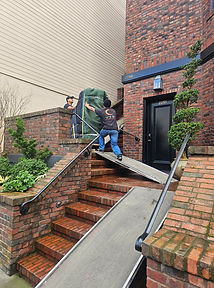 Luna’s Piano Movers moving a piano on stairs in Los Angeles