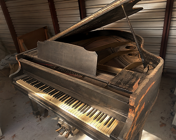 Piano showing damage caused by improper storage conditions