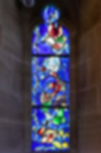 Window 7, a red tumbling angel, bird