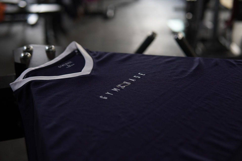 Navy blue v neck gymchase t-shirt with white v neck collar in a gym