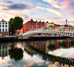 Dublin, Ireland. Night view of famous illuminated Ha Penny Bridge in Dublin, Ireland at su