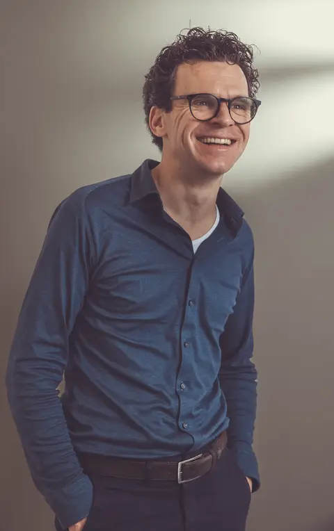 Informal business portrait of an architect in an office environment