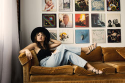 dayton senior photographer with cool record wall and hat props and backdrops and seamless paper