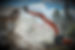 industrial excavator working at the demolition of an old residential building_edited.jpg