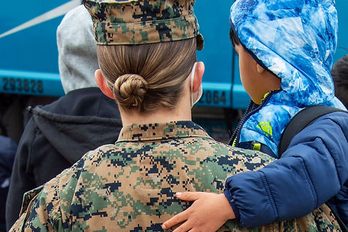 Getting settled child with female soldier.jpg