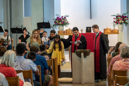 Close-up of hands during baptism prayer, Ortega Photography