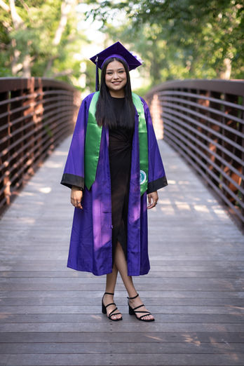 Highschool girl graduation photoshoot, purple toga, honor rollin Austin, TX by Ortega Photography.