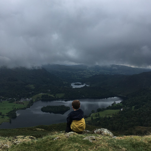 A moment of contemplation for Little Chap #2. Summit of Silver How, overlooking Grasmere and Rydal Water