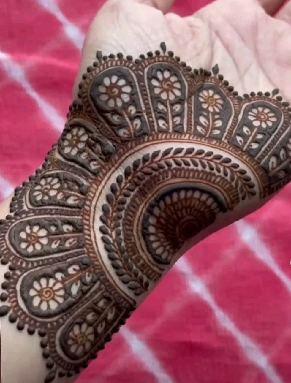 big mehndi design in flower on wrist