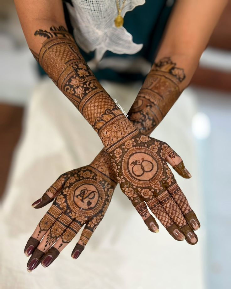 bridal mehndi design with initials and rings. Mehndi design on both hands