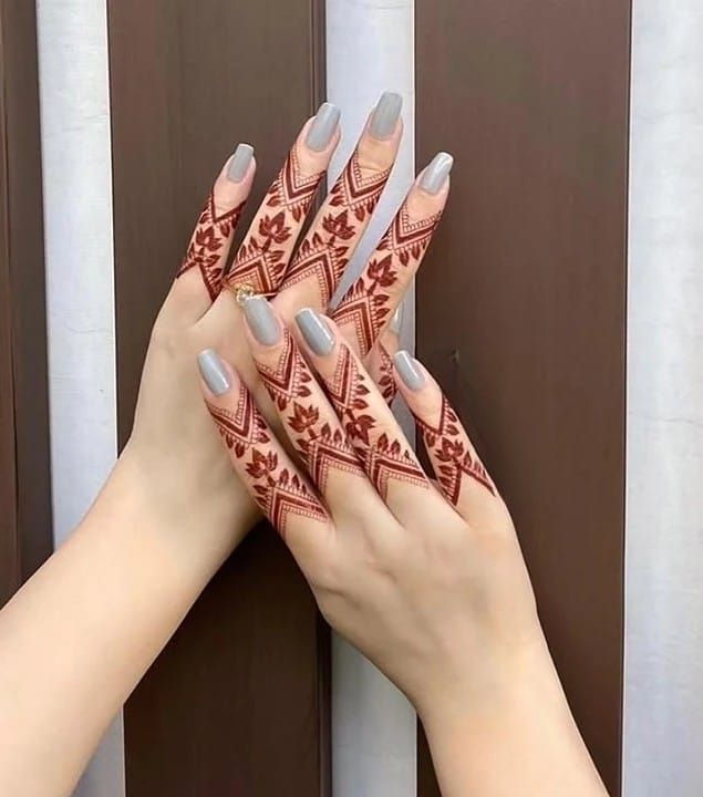 mehndi on both hand on finger and grey nail color
