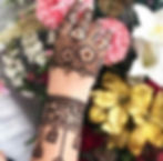 mehndi design on fingers and a bracelet