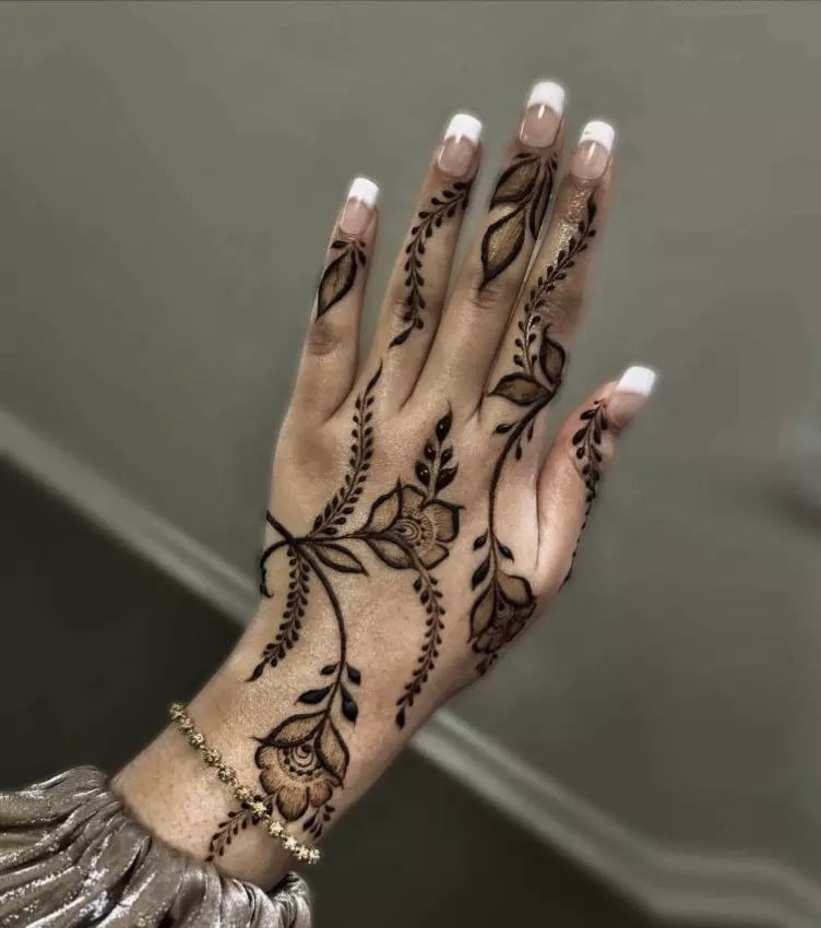 mehndi design on left hand white nail tips