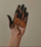 fingers filled in mehndi and big flowers