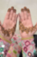 flower trails in mehndi on both hands