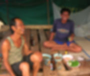 Thai construction workers enjoying dinner and drinks.
