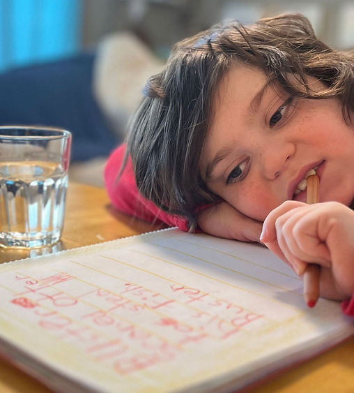 Child focused on writing