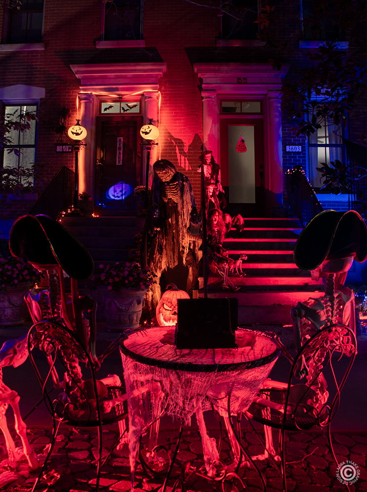 Just a couple skeletons having tea, watching the guests walk by.