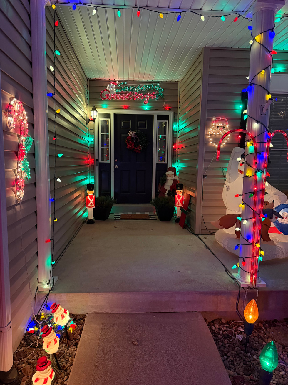 The font door of this Christmas house on Holiday Light Hopping