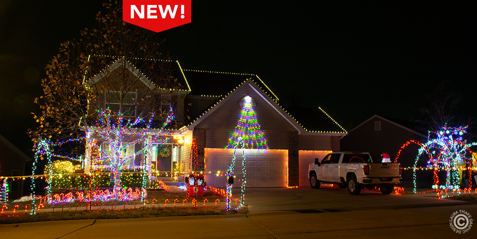 Christmas lights near me in Pacific Mo. with candy canes and lights all over the house.