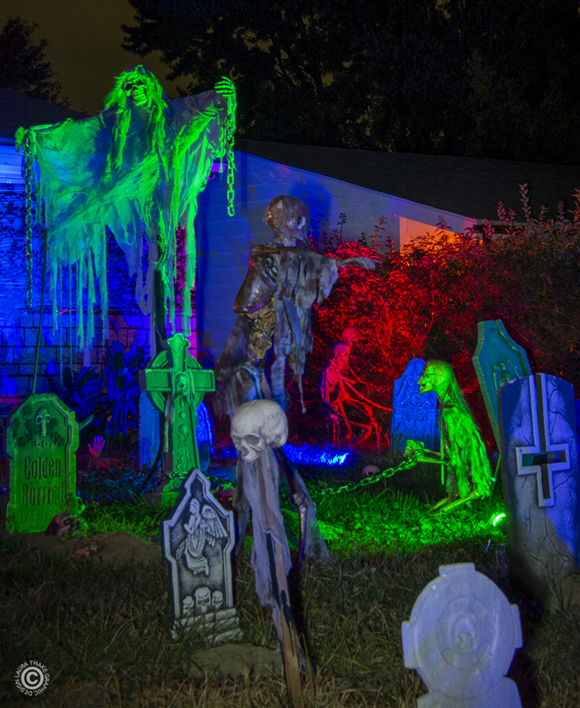 Skeletons in a graveyard burying bodies on Holiday Light Hopping.