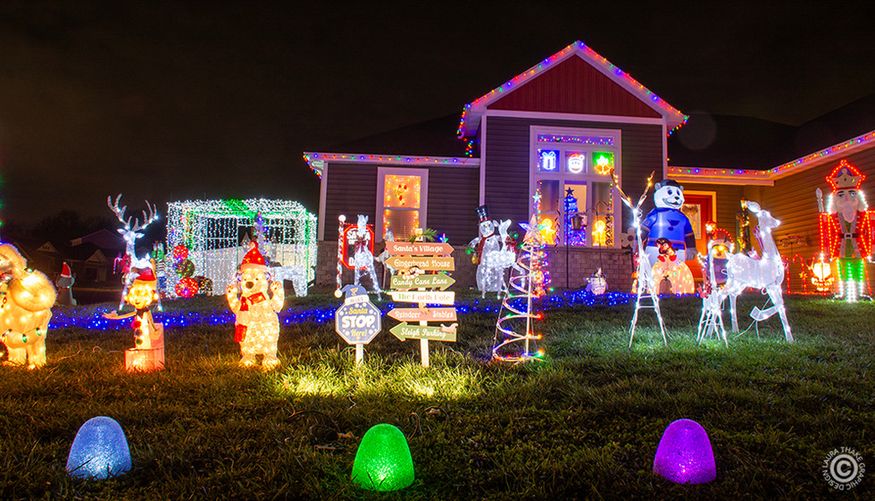 Gumdrops line the sidewalk with cute characters behind.