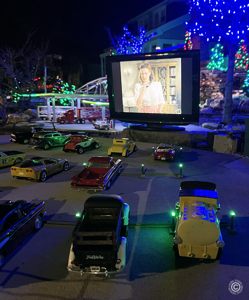 The drive-in movie is full of cars.