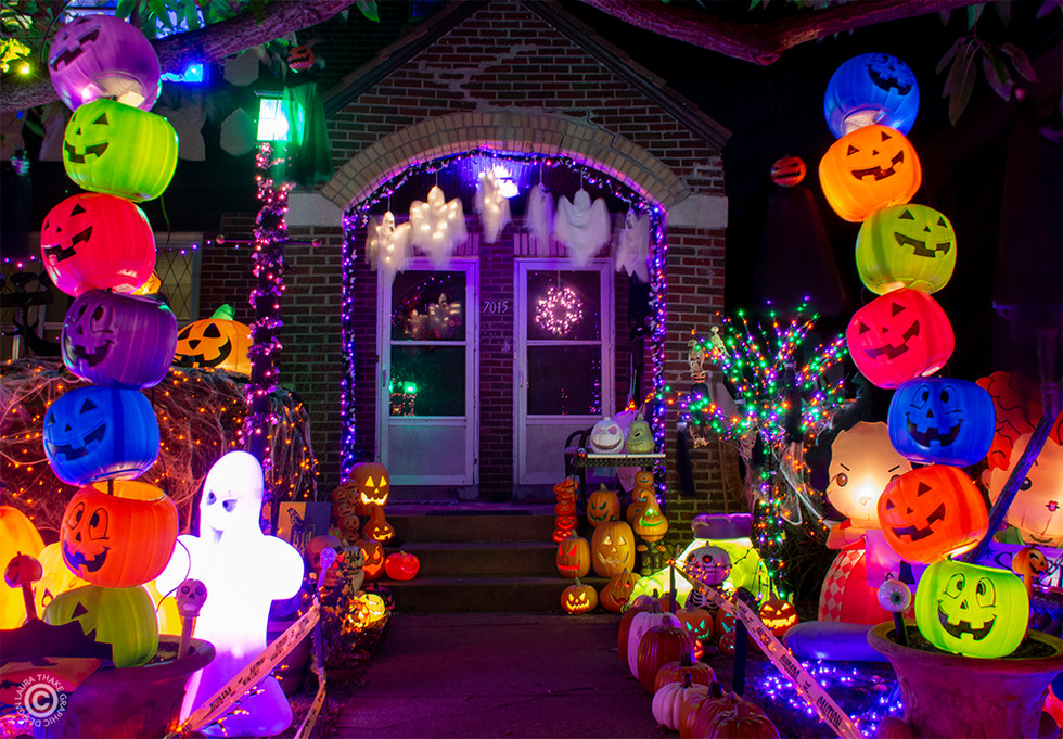 Cutely decorated with pumpkins this front porch on Holiday Light Hopping is sure to make you feel welcome.