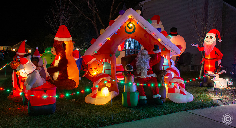 Santa Christmas inflatable with lots of other inflatables.