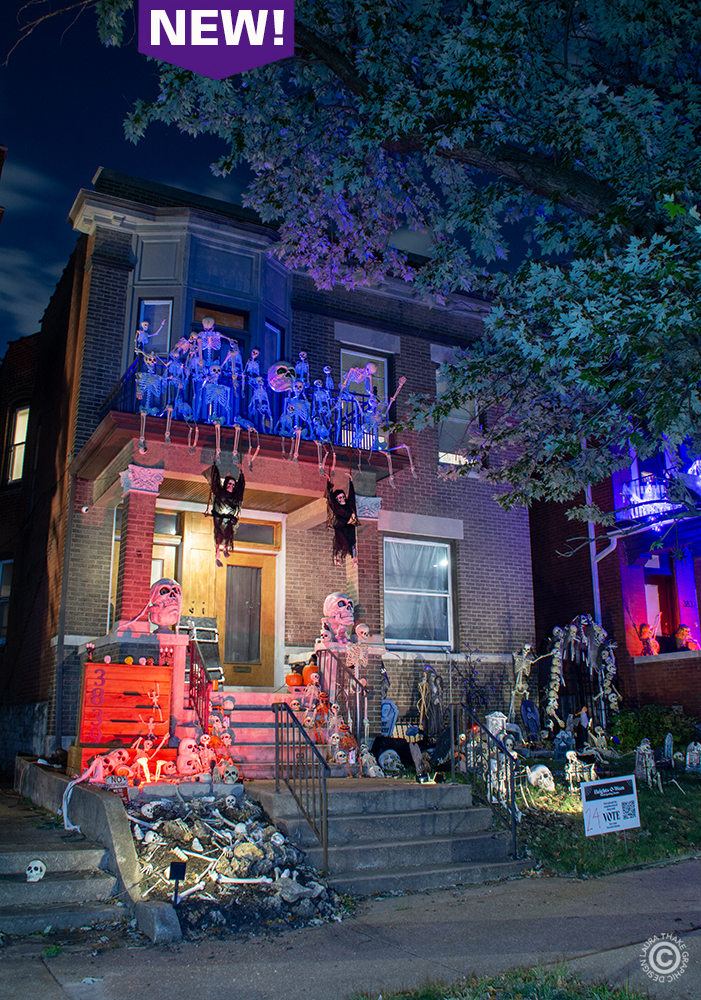 two stories of skeletons and lighting cover this house in St. Louis for Halloween