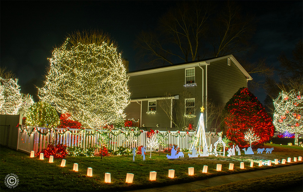 There are luminaries lining the sidewalk as well.