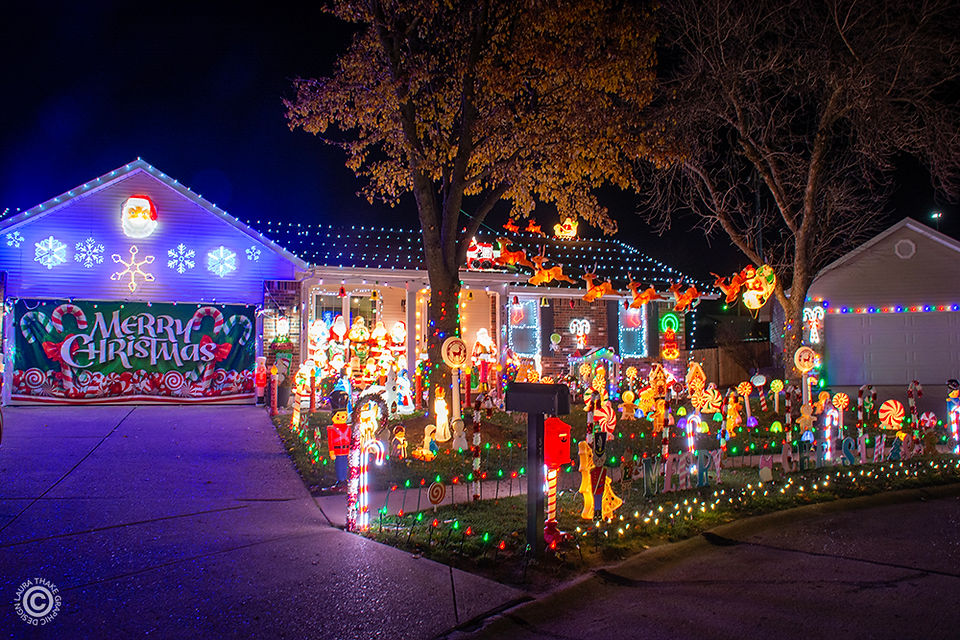 Santas all lined up on the porch and blow molds everywhere!