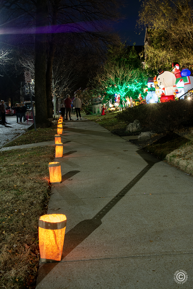 traditional luminaries lining the sidewalk.