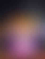 The gazebo is all lit up and covered in garland.