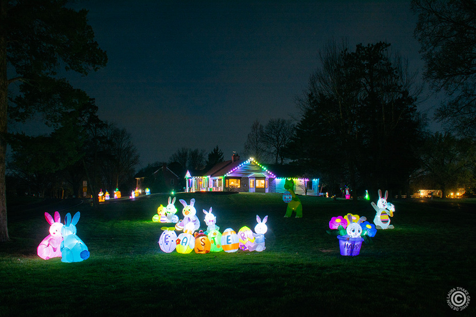 The wide view from Lindbergh Blvd. where you can see all the Easter inflatables spread out across the yard.
