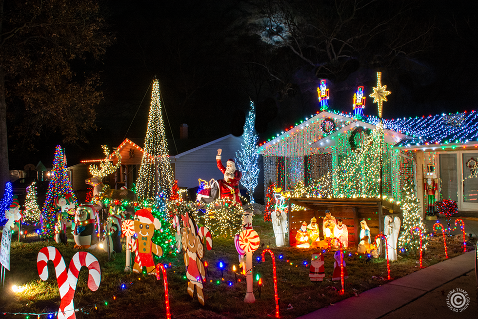 The manger scene is vintage blow mold with gingerbread kids and toy soldiers on the roof.