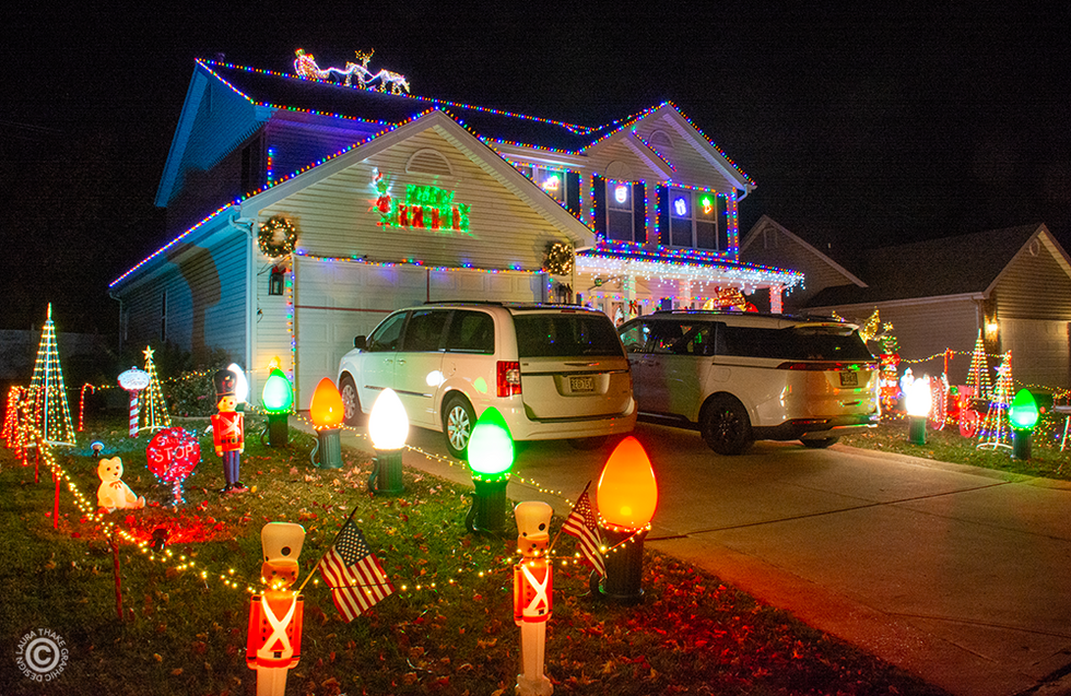 Giant light bulbs lining the driveway give Santa a clear path to the chimney.