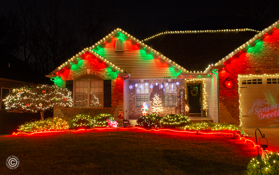 Pretty red green and white lights adorn a house on Holiday Light Hopping.