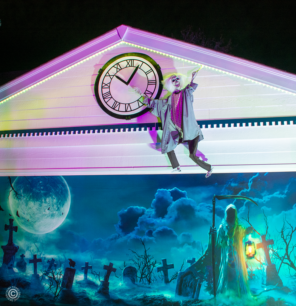Doc Brown is fiddling with time above the garage door.