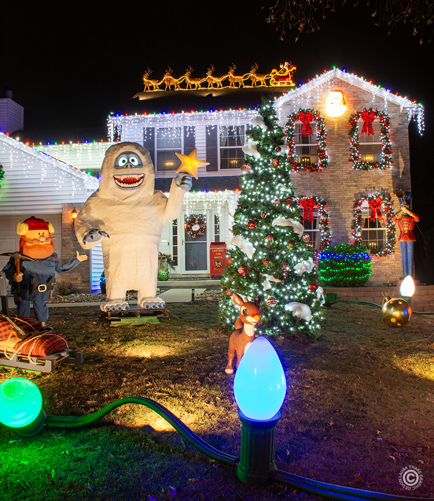 Big and Tall Christmas display at a house in Oakville with many colored lights.