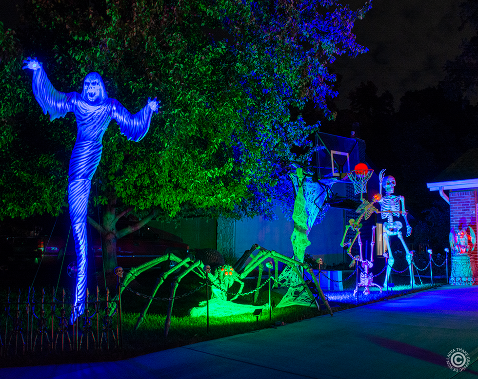 A skeleton slam dunking in the basketball hoop.