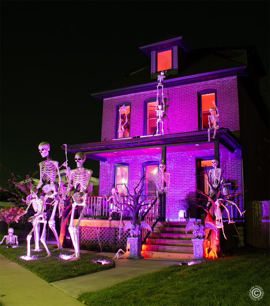 Two 12 foot tall Skelly's and lots of other skeletons crawling all over the house!