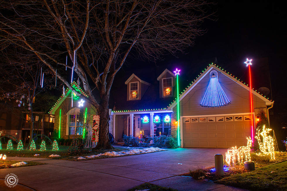 Magical Christmas lights set to music with a Santa walking around in the house, checking his list.